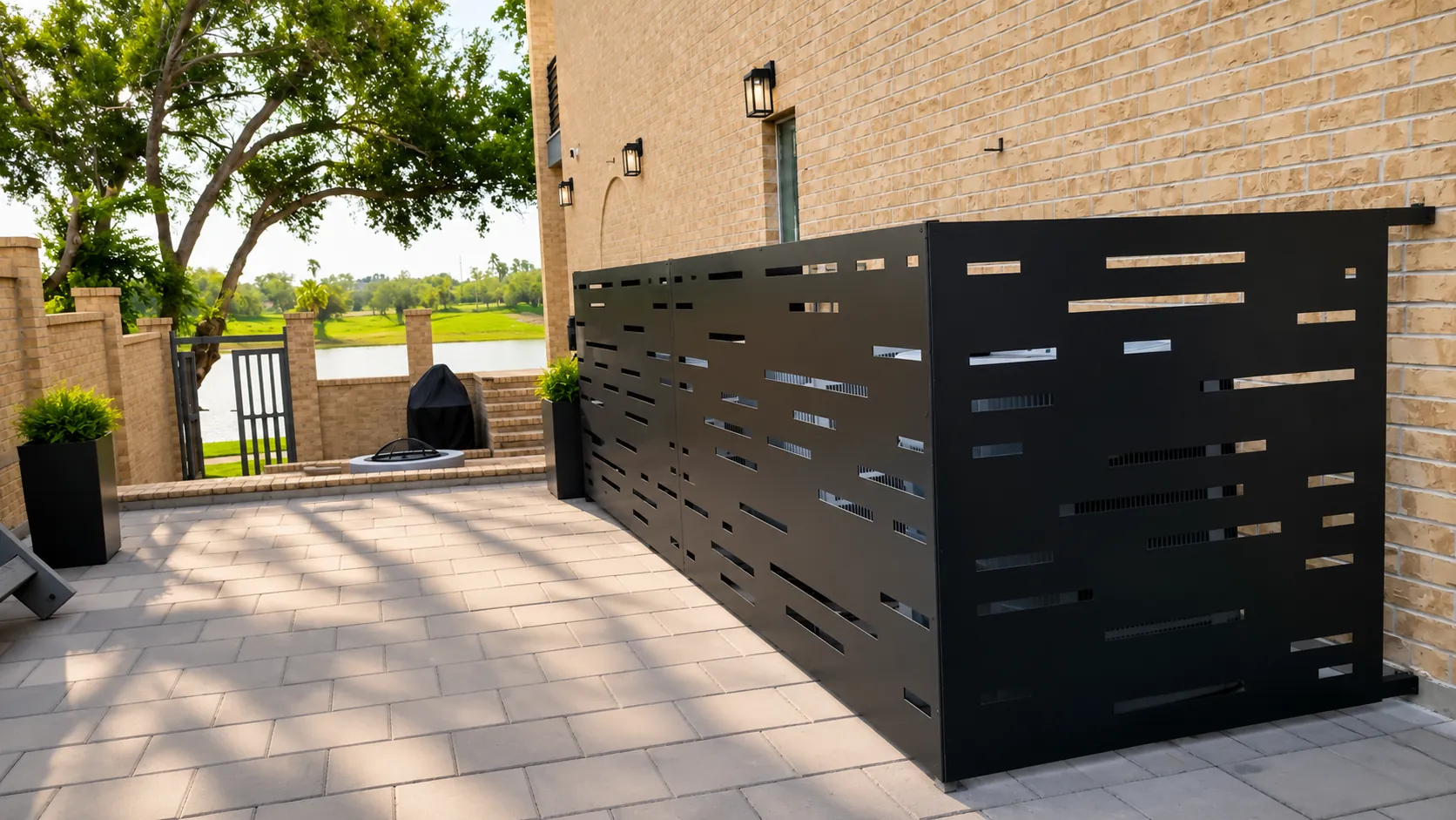 Black aluminum equipment screen installed on a patio