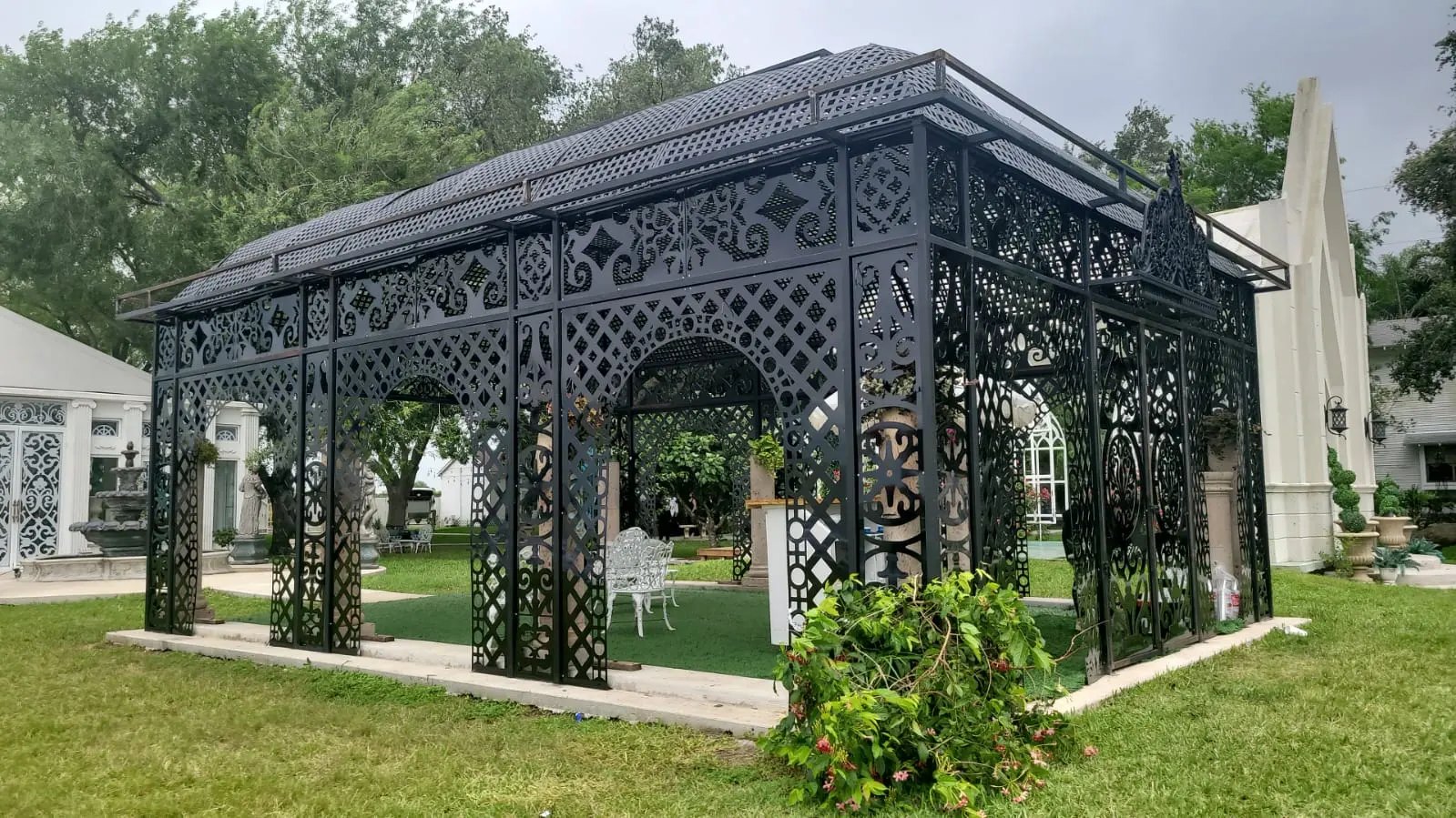 Large black ornamental pergola structure