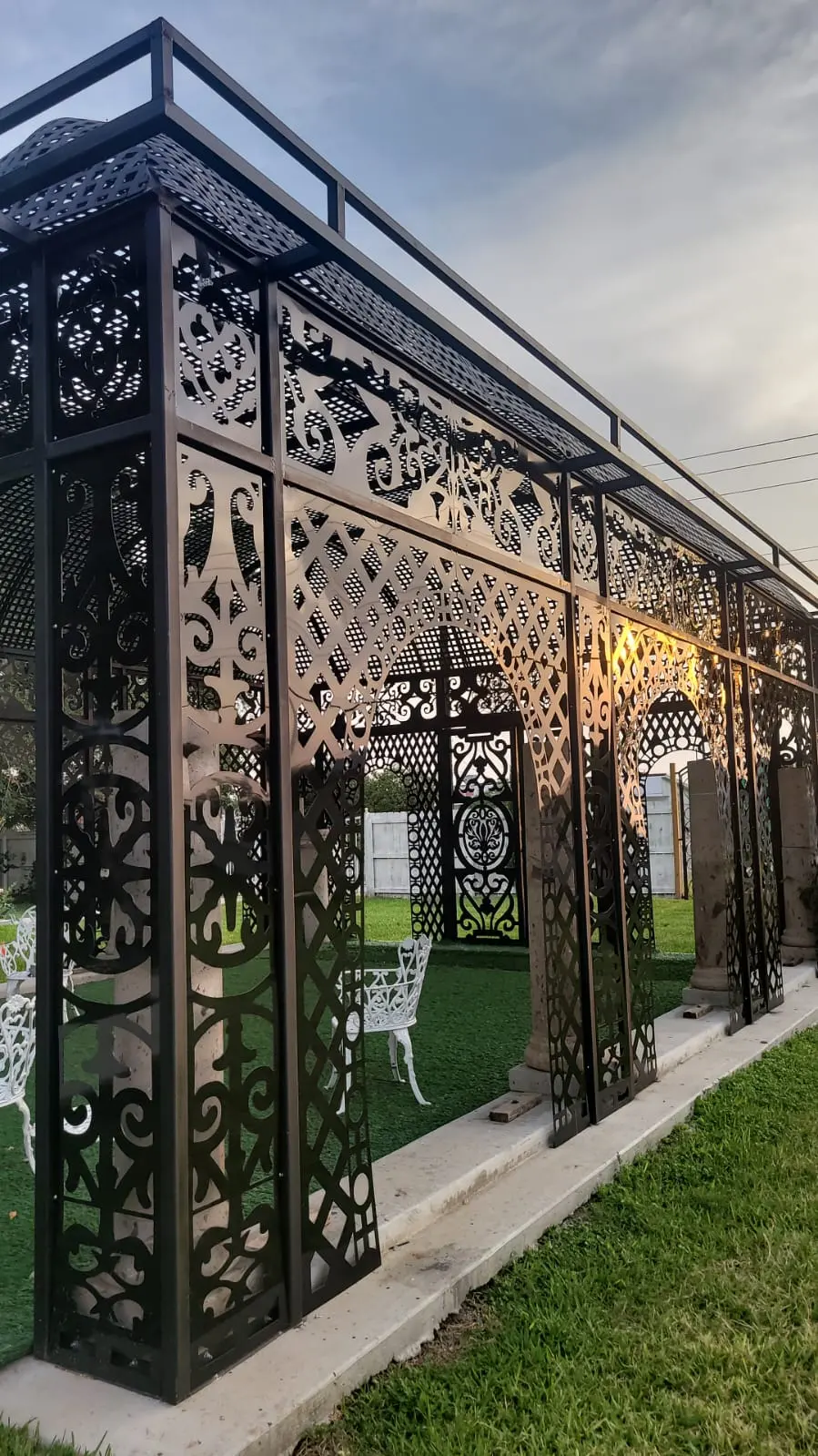 Close view of black ornamental pergola panels
